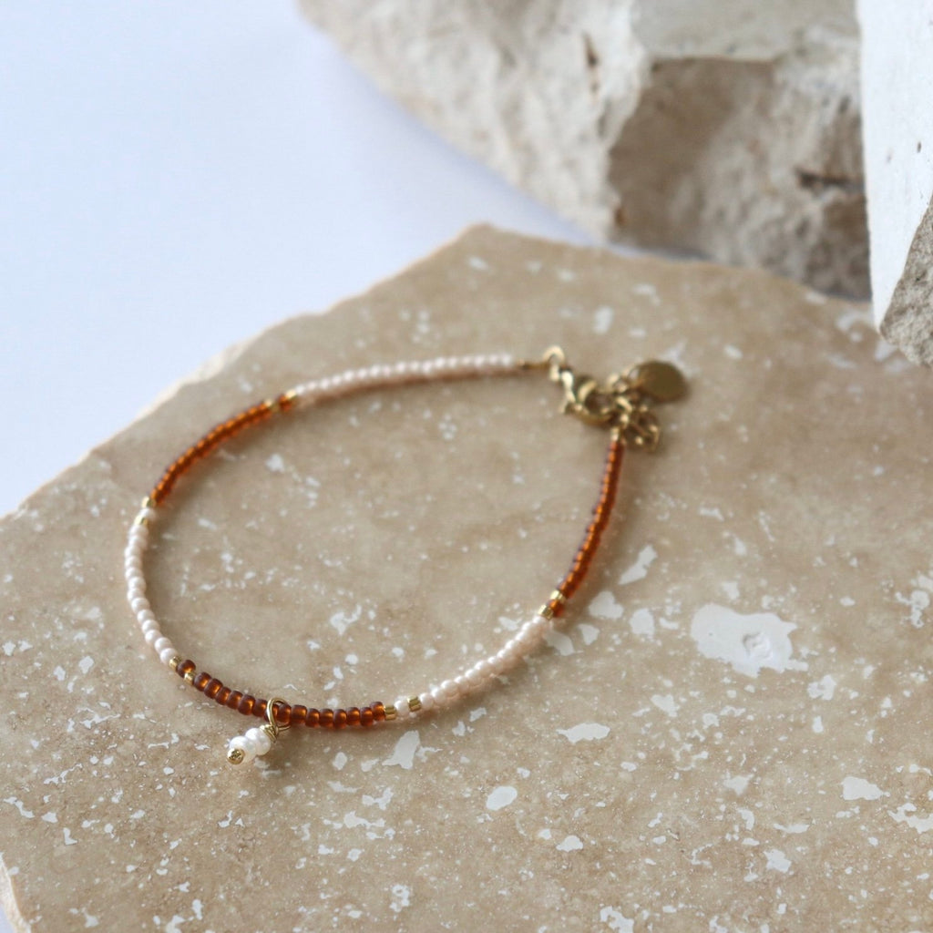Bracelet with beads on a textured surface