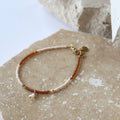 Bracelet with beads on a textured surface